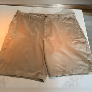 Men’s khaki izod xfg golf shorts.  Cargo zippered pockets. Size 42.